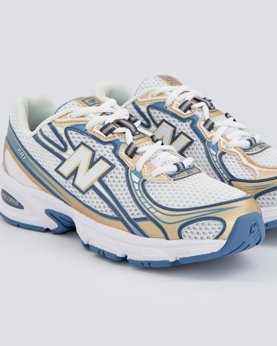 New Balance 740 Azul y Dorado Mujer