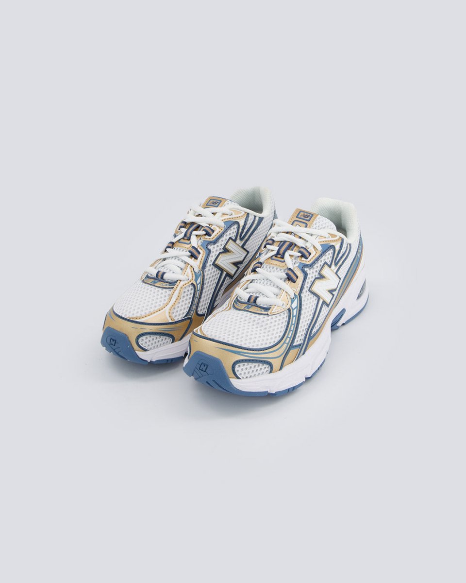 New Balance 740 Azul y Dorado Mujer