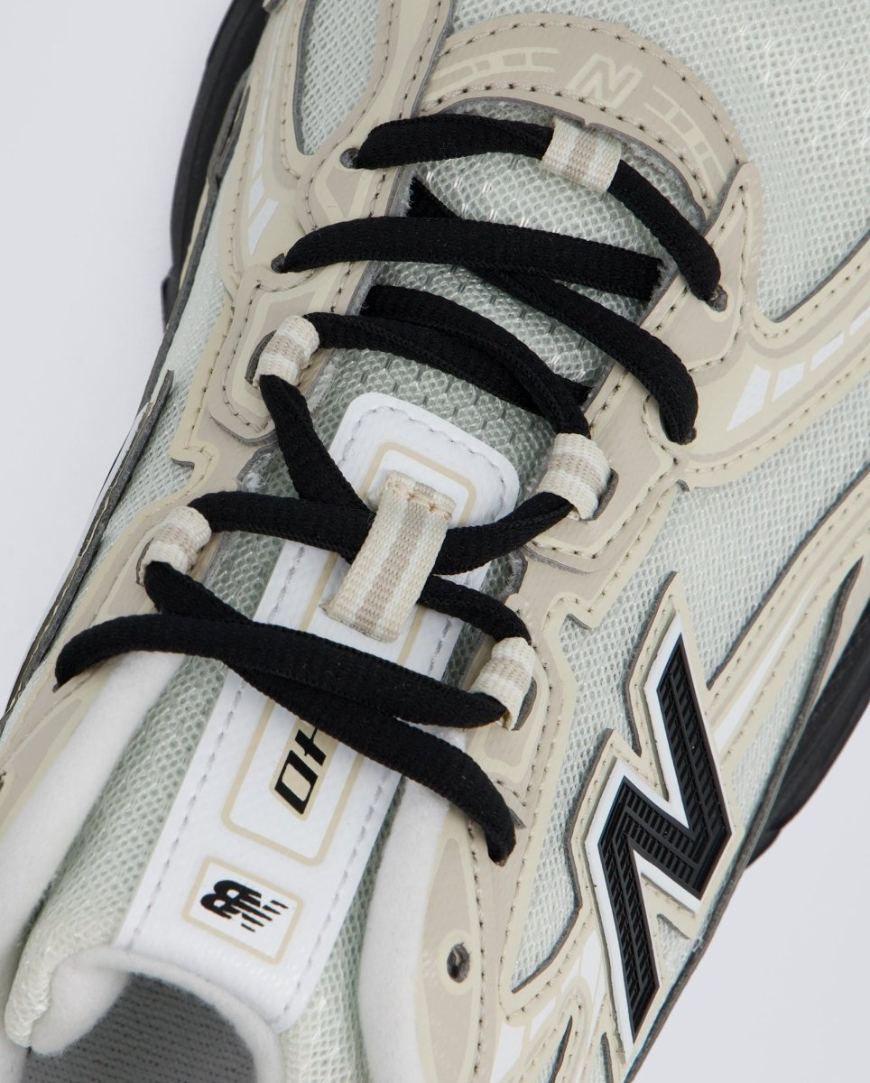 New Balance U7404OO Beiges y Negras Hombre