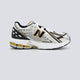 New Balance M1906Ra Lineas Doradas Mujer